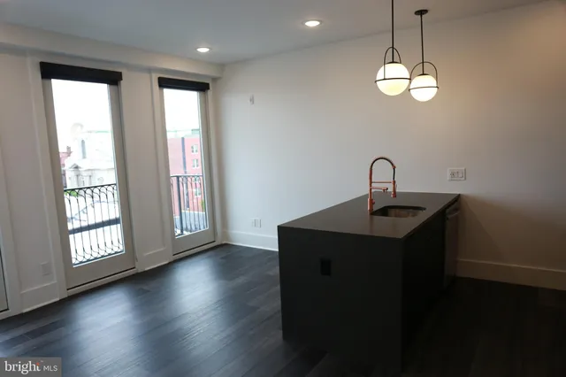 a kitchen with appliances and cabinets