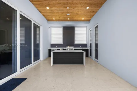 a spacious bedroom with a bed and large window