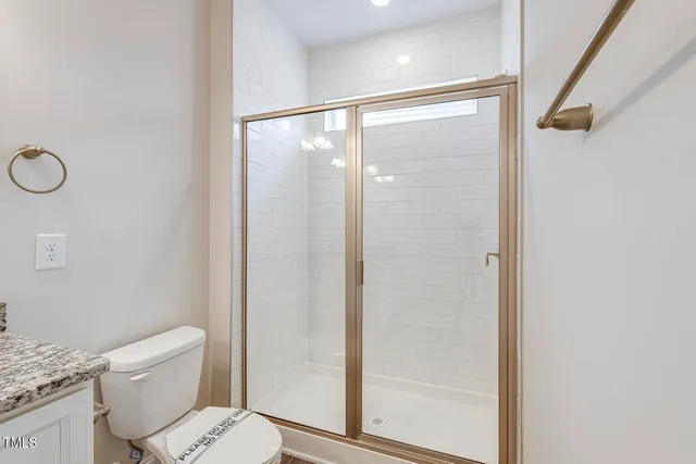 a bathroom with a bathtub and a toilet