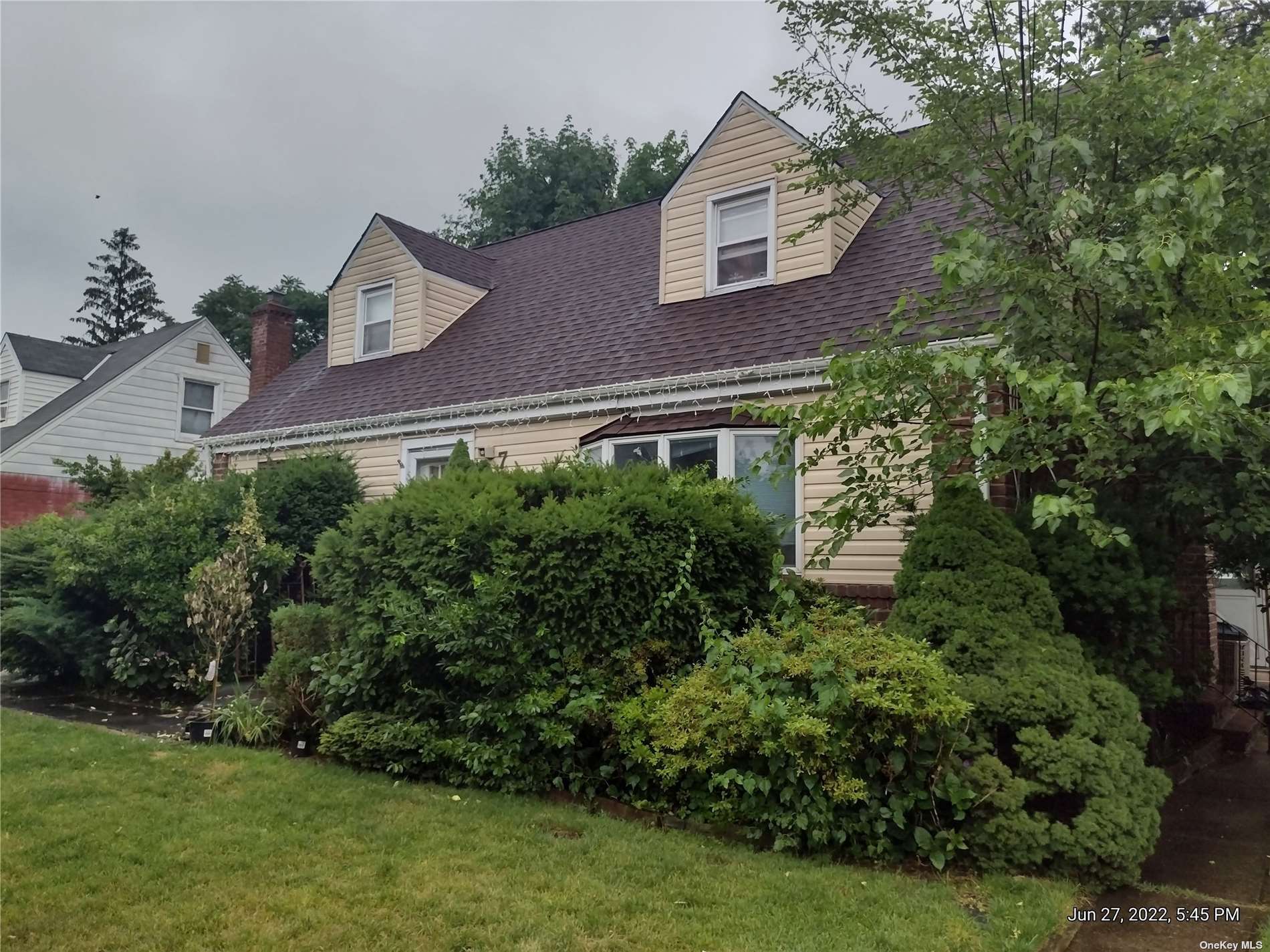 751 Arthur Street West Hempstead, NY 11552 - Photo 1 of 1 a aerial view of a house with a yard and potted plants