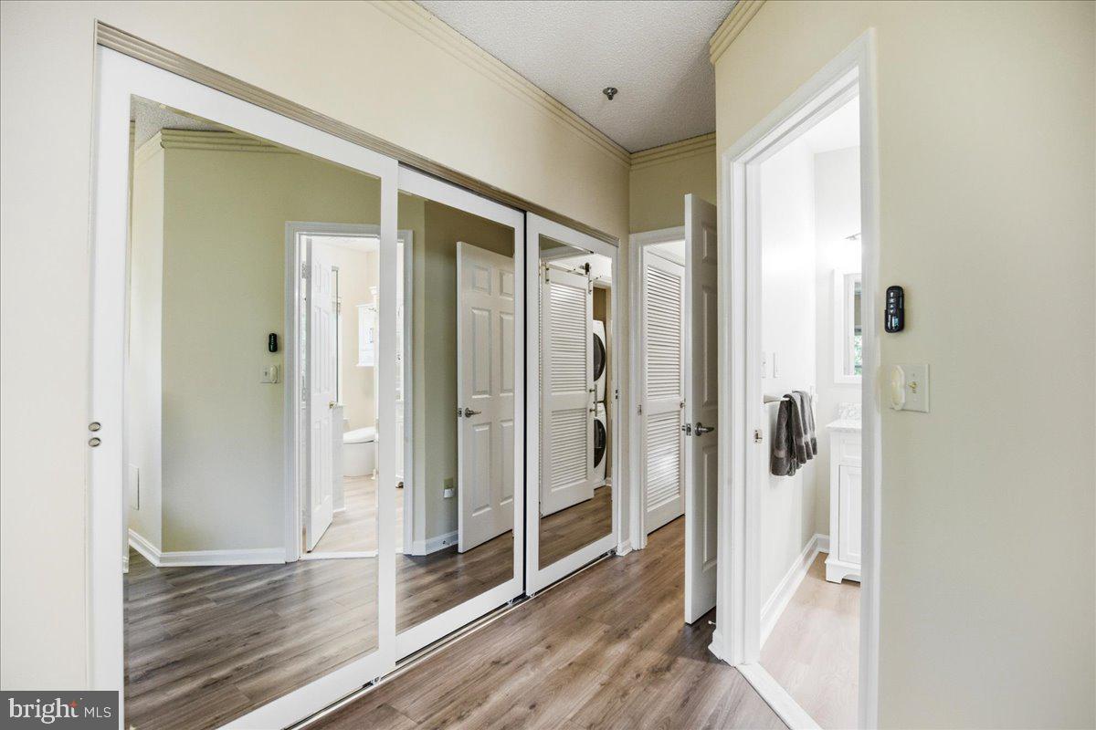 1126 Back Creek Loop, Unit 1126 Solomons, MD 20688 - Photo 30 of 47 a view of a bathroom with a shower and closet