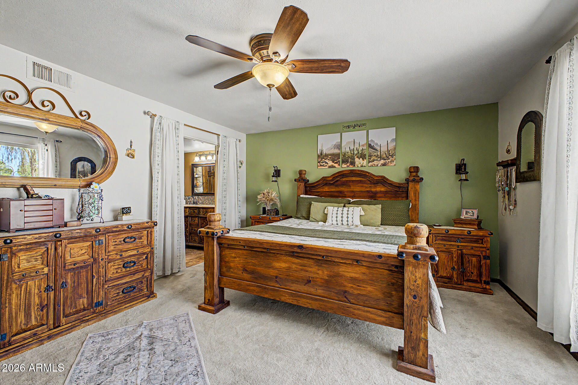 18722 East Rio Lane Rio Verde, AZ 85263 - Photo 17 of 55 a bedroom with a bed and a chandelier