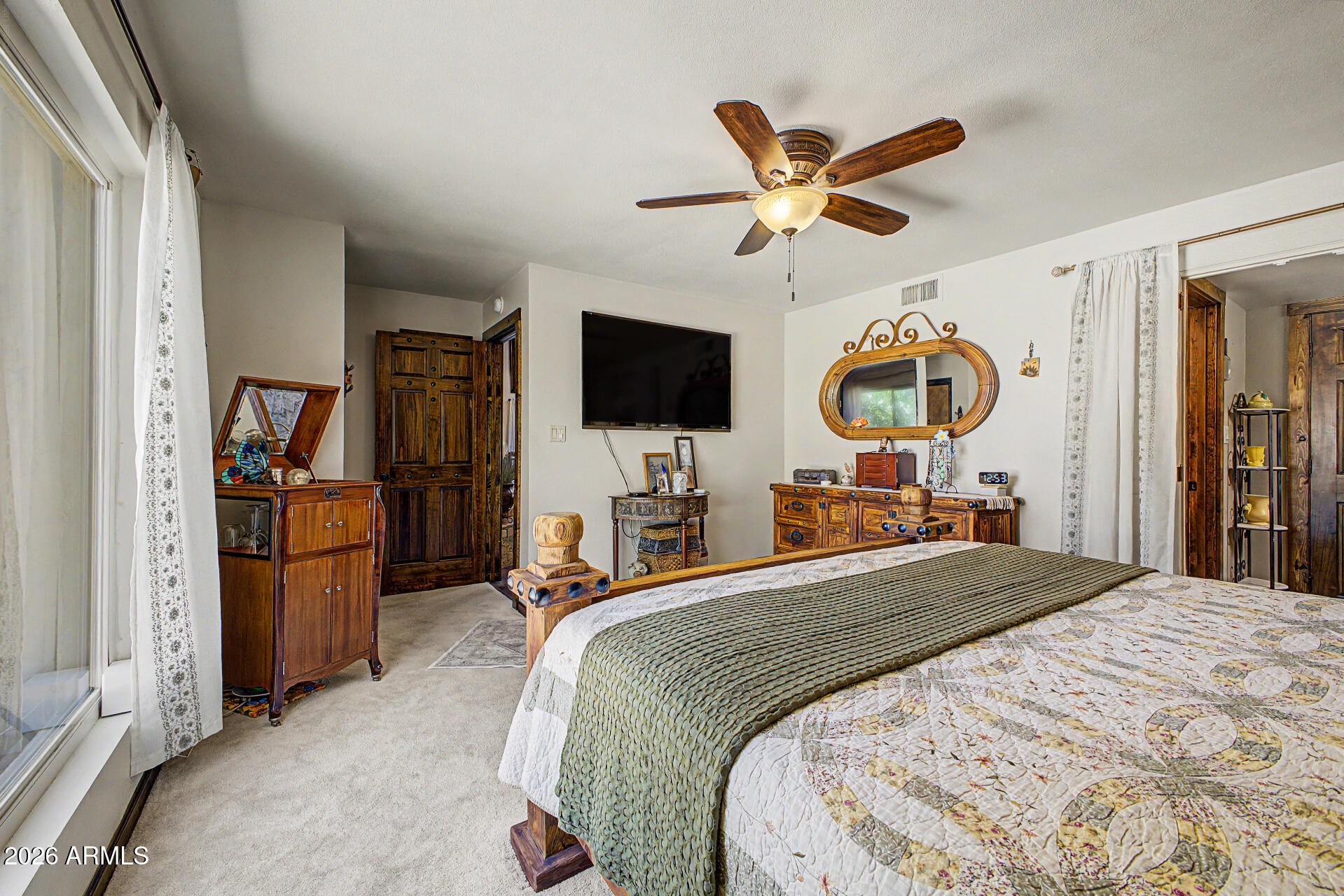 18722 East Rio Lane Rio Verde, AZ 85263 - Photo 18 of 55 a bedroom with a bed and a flat screen tv