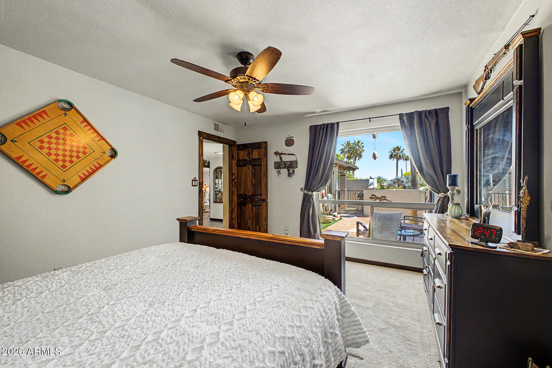 18722 East Rio Lane Rio Verde, AZ 85263 - Photo 21 of 55 a bedroom with a bed and a large window