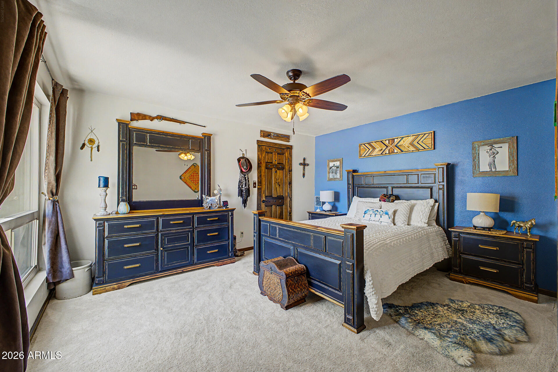 18722 East Rio Lane Rio Verde, AZ 85263 - Photo 22 of 55 a bedroom with a bed and a chandelier on dresser
