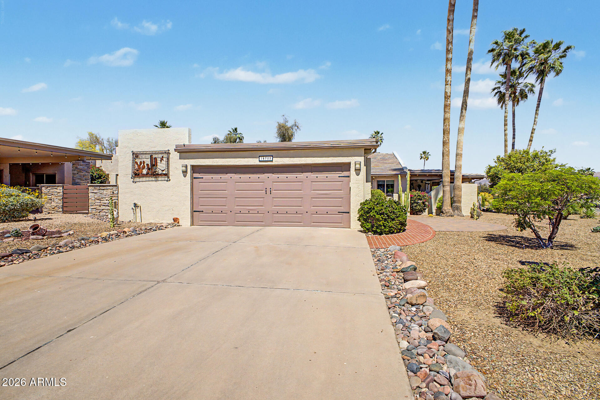 18722 East Rio Lane Rio Verde, AZ 85263 - Photo 3 of 55 a front view of a house with a yard and garage