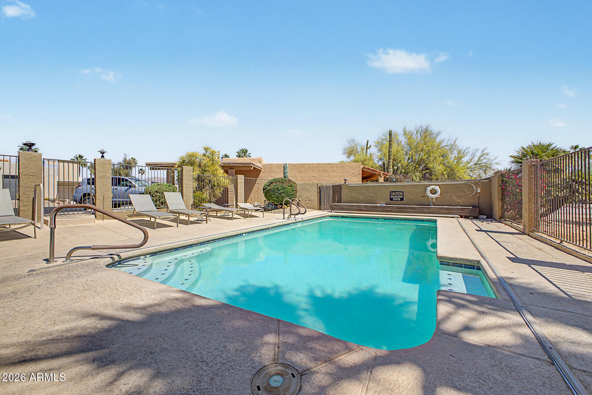18722 East Rio Lane Rio Verde, AZ 85263 - Photo 32 of 55 a view of a swimming pool with a patio
