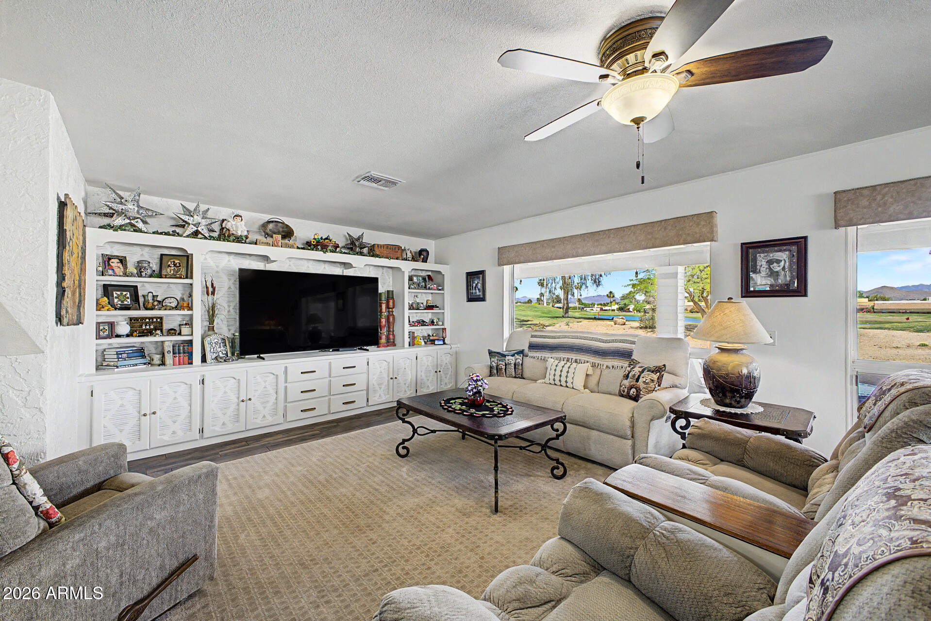 18722 East Rio Lane Rio Verde, AZ 85263 - Photo 8 of 55 a living room with furniture and a flat screen tv