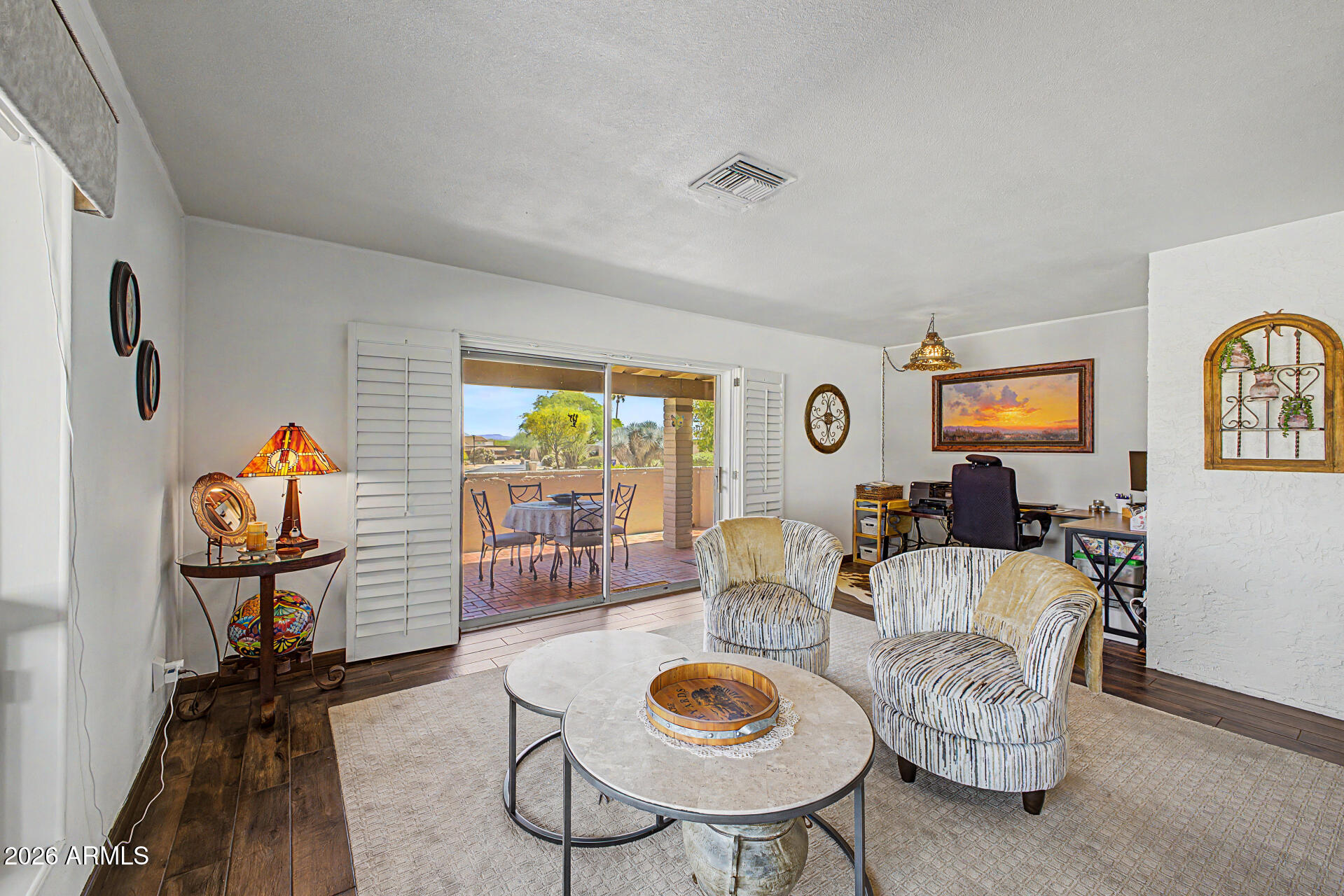 18722 East Rio Lane Rio Verde, AZ 85263 - Photo 9 of 55 a living room with furniture a rug and a flat screen tv