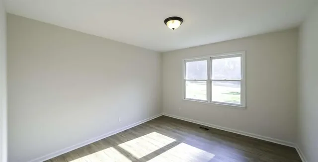 an empty room with windows