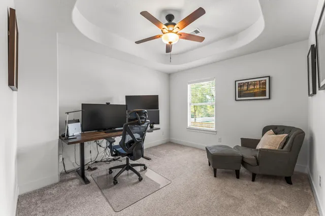 a work room with furniture and a window