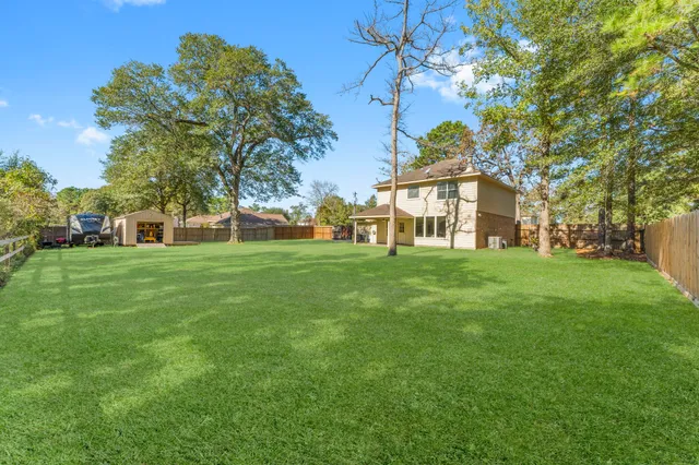 a view of a house with a big yard