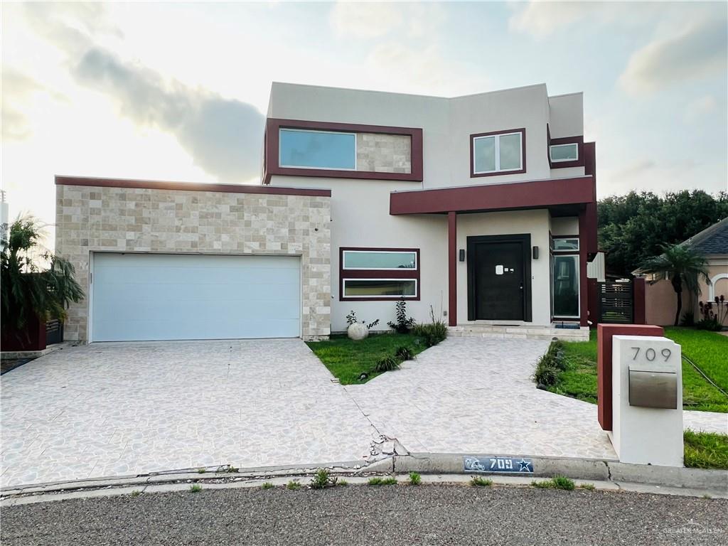 a front view of a house with yard