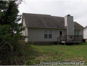 3250 Winesap Road Hope Mills, NC 28348 - Photo 3 of 9 a view of a house with a backyard