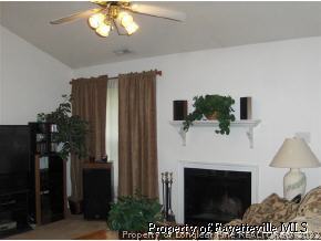 3250 Winesap Road Hope Mills, NC 28348 - Photo 6 of 9 a living room with furniture and a fireplace