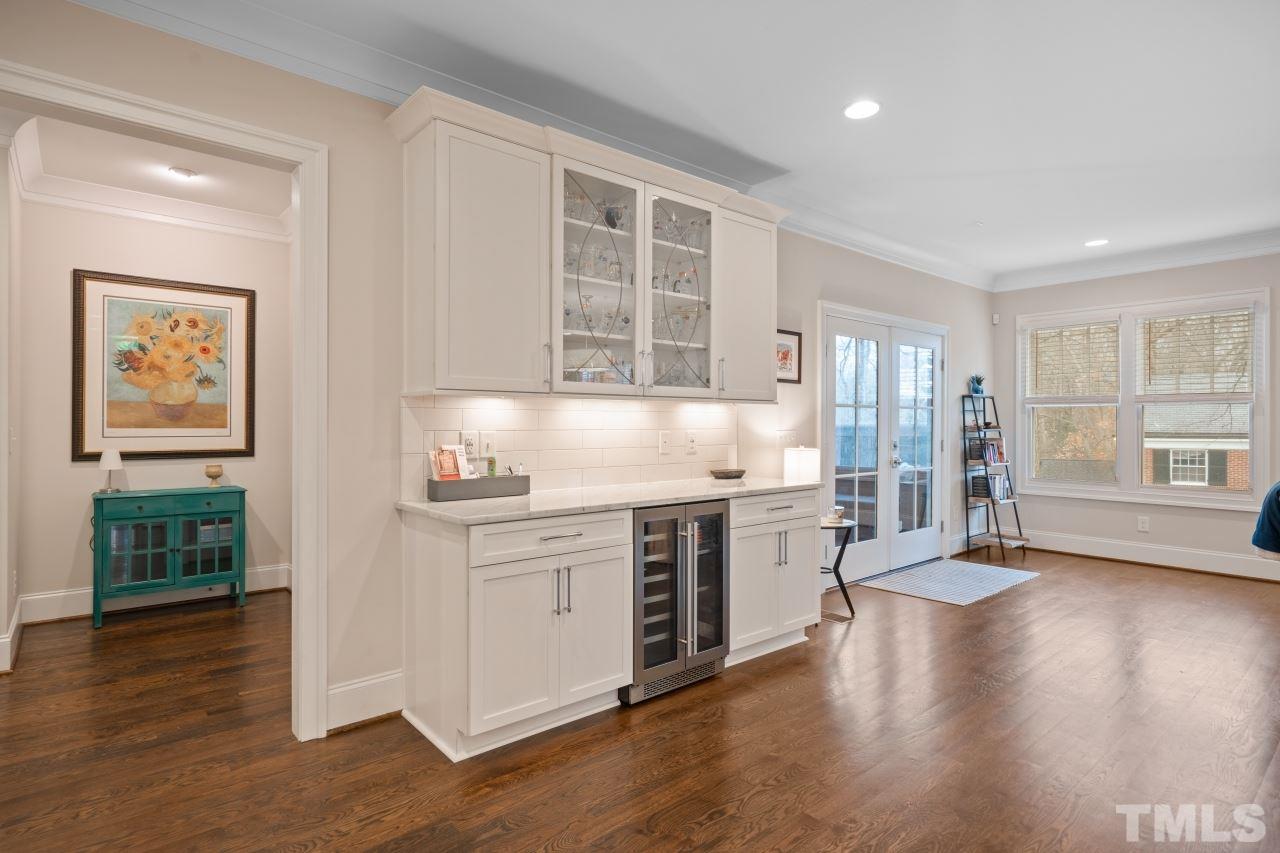 2217 Alexander Road Raleigh, NC 27608 - Photo 12 of 30 a kitchen with stainless steel appliances granite countertop a stove and a refrigerator