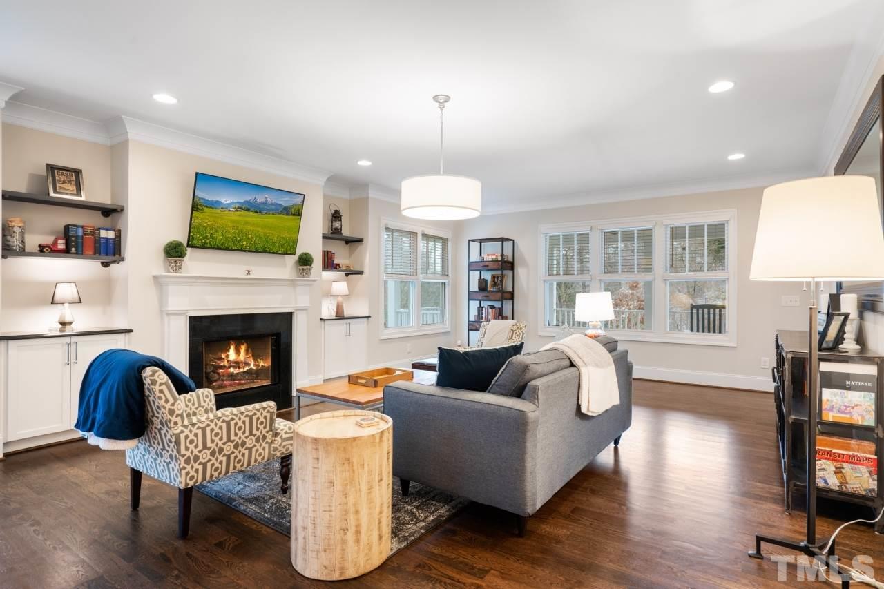 2217 Alexander Road Raleigh, NC 27608 - Photo 15 of 30 a living room with furniture fireplace and window