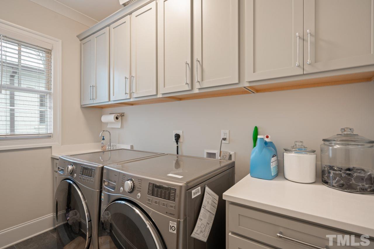 2217 Alexander Road Raleigh, NC 27608 - Photo 17 of 30 a utility room with dryer and washer