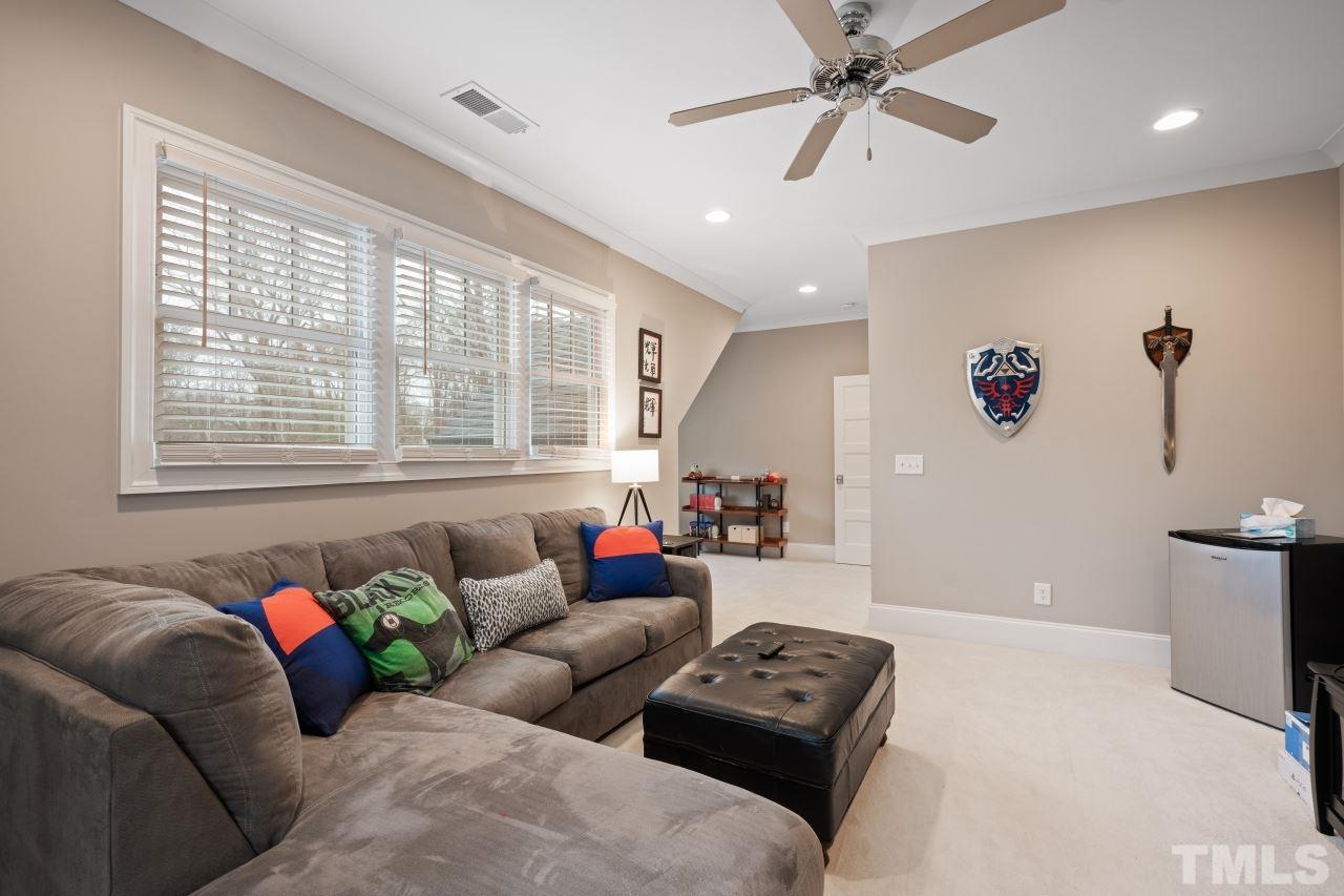 2217 Alexander Road Raleigh, NC 27608 - Photo 27 of 30 a living room with furniture and a window
