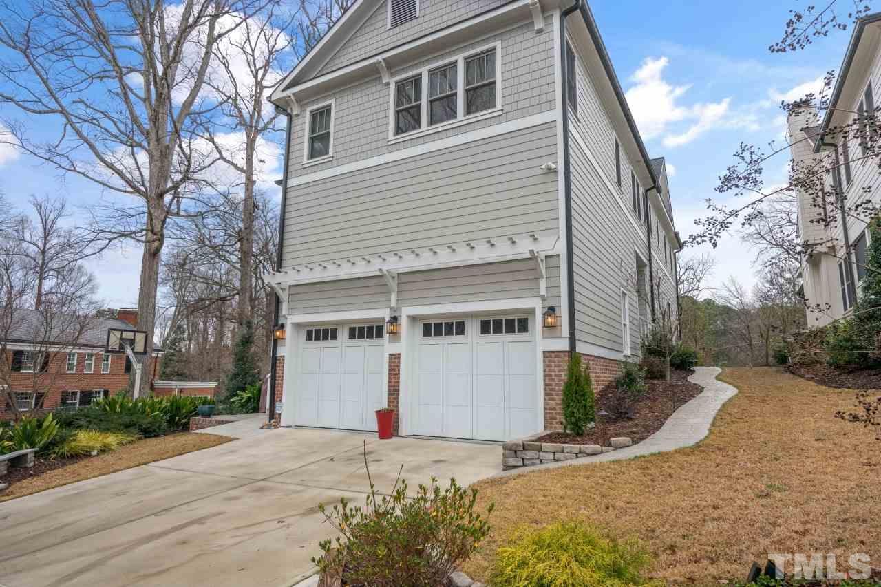 2217 Alexander Road Raleigh, NC 27608 - Photo 29 of 30 a view of a house with a yard covered with snow