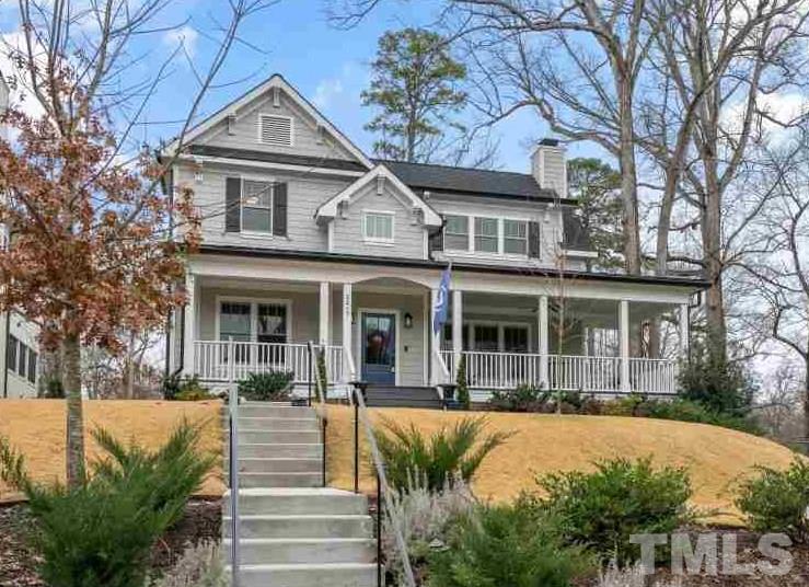2217 Alexander Road Raleigh, NC 27608 - Photo 4 of 30 a front view of a house with a porch