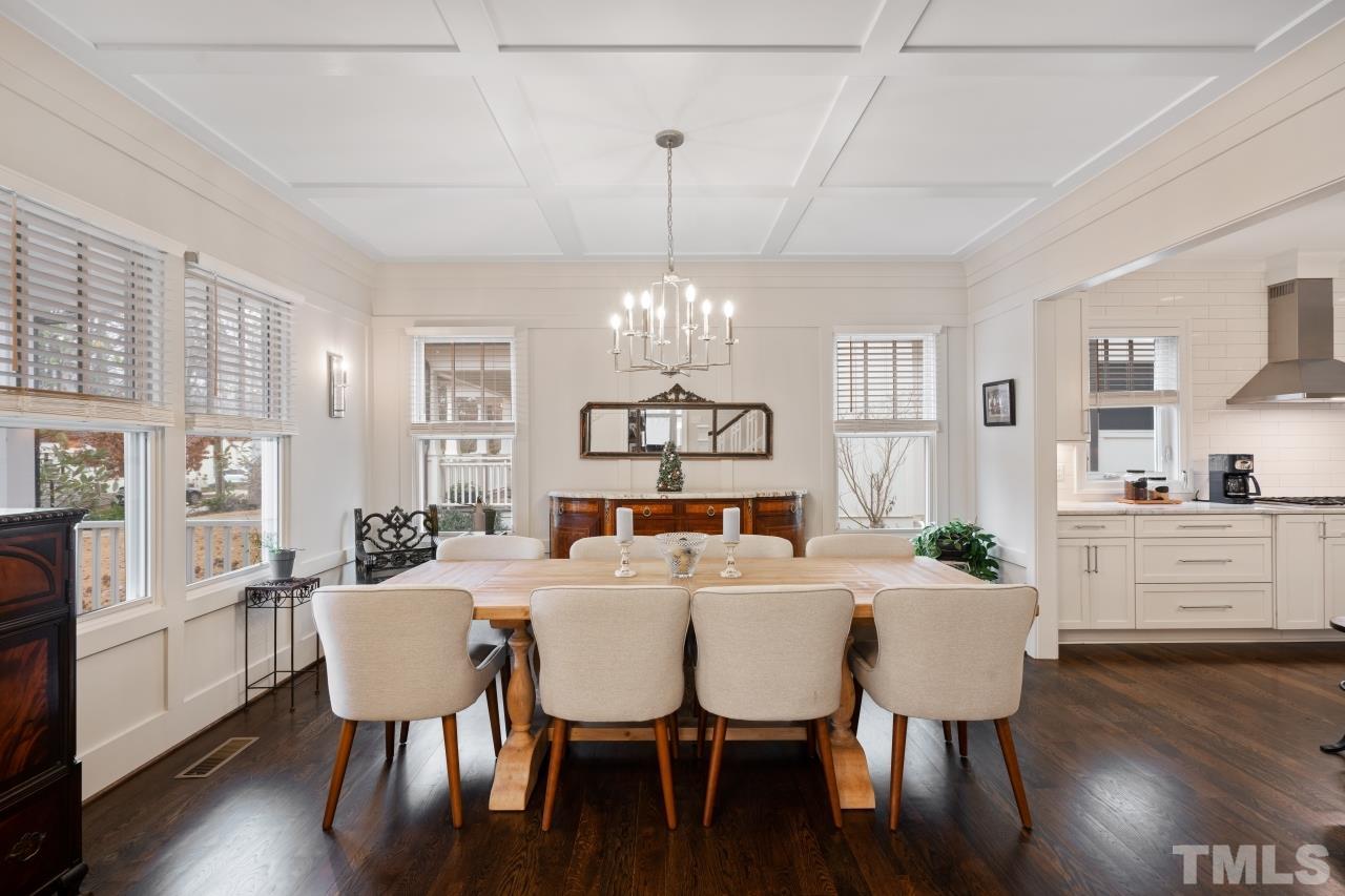 2217 Alexander Road Raleigh, NC 27608 - Photo 10 of 30 a view of a dining room with furniture window and wooden floor