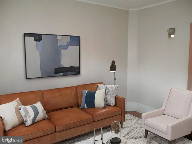 a living room with a couch and a table