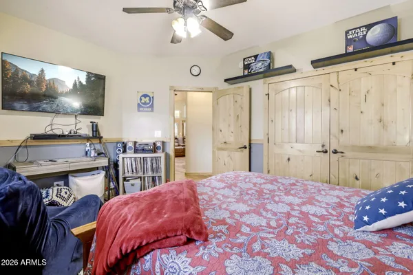 a bedroom with a bed and a couch