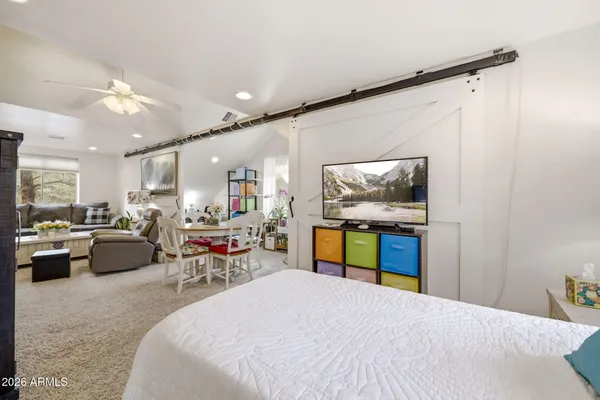 a view of living room with furniture and a flat screen tv