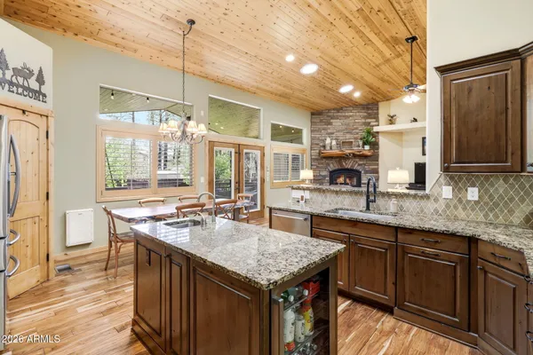 a kitchen with a stove a sink and a refrigerator