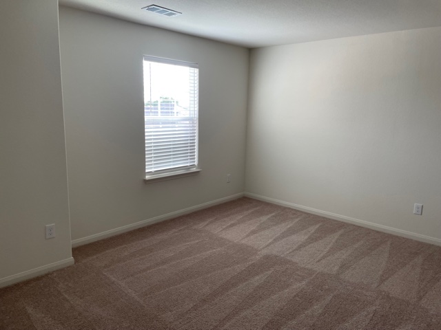 18741 Speculator Lane Elgin, TX 78621 - Photo 21 of 28 Empty room with carpet and baseboards