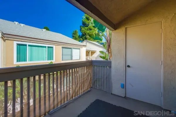a view of porch with a small yard