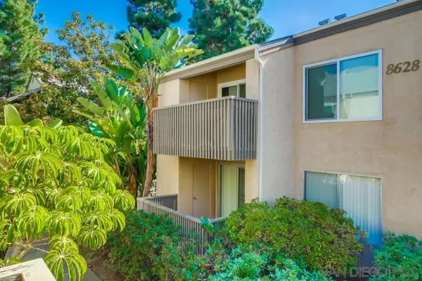 a view of a backyard of the house