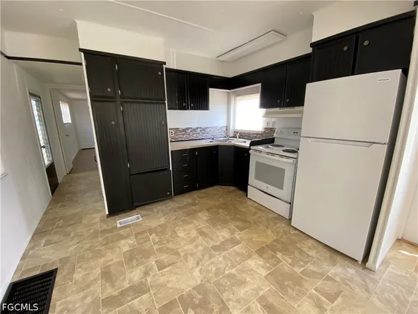 a view of a back yard of the house