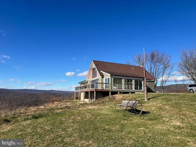 a front view of a house with a ocean view