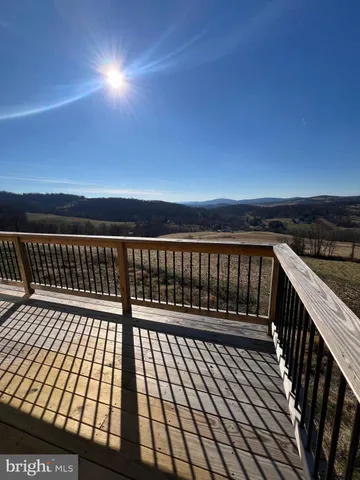 a view of balcony with wooden floor