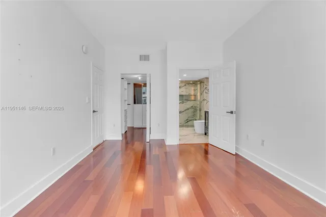 a view of front door with wooden floor
