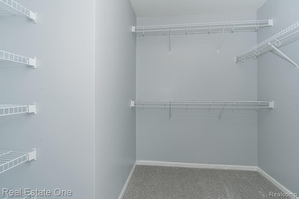 3491 Tremonte Circle Rochester, MI 48306 - Photo 22 of 42 Carpeted closet space with multiple wire shelving units