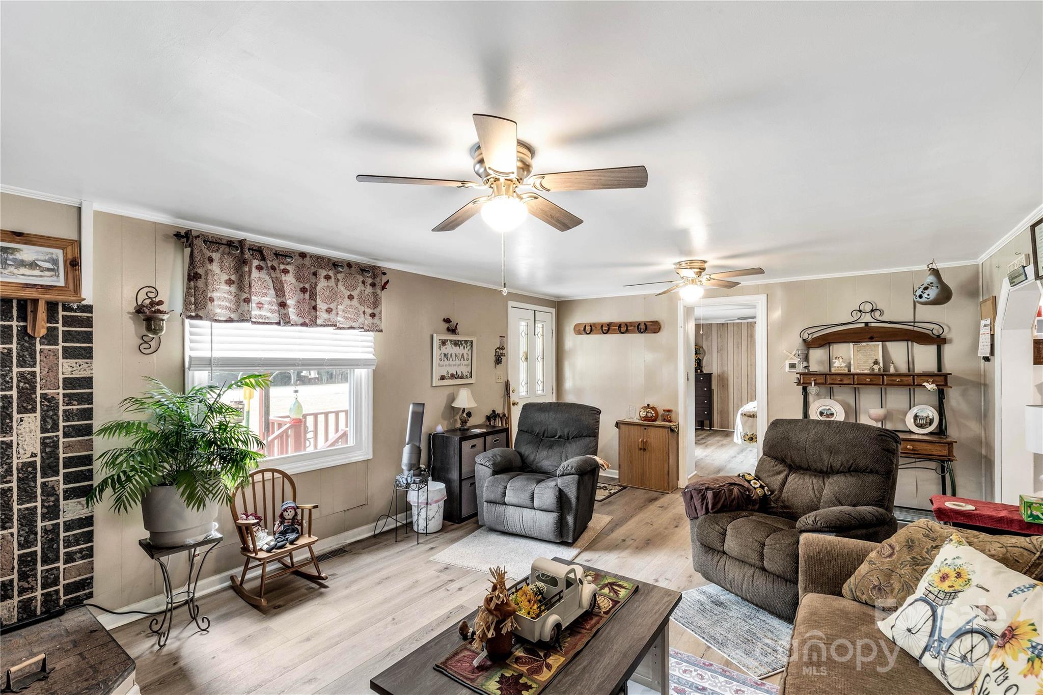 1164 Stroupe Road Lancaster, SC 29720 - Photo 11 of 37 a living room with furniture a chandelier and a window