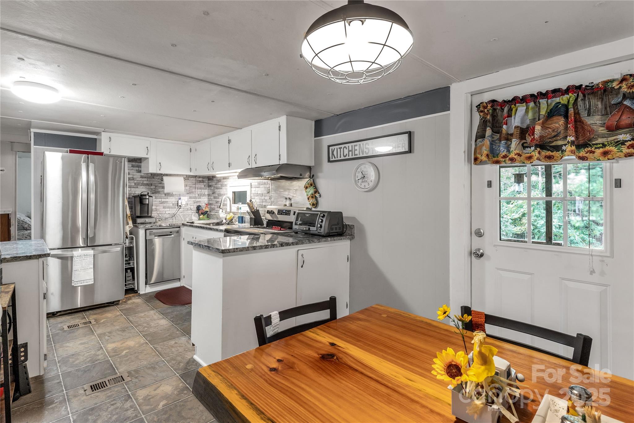 1164 Stroupe Road Lancaster, SC 29720 - Photo 15 of 37 a kitchen with a refrigerator and a stove top oven