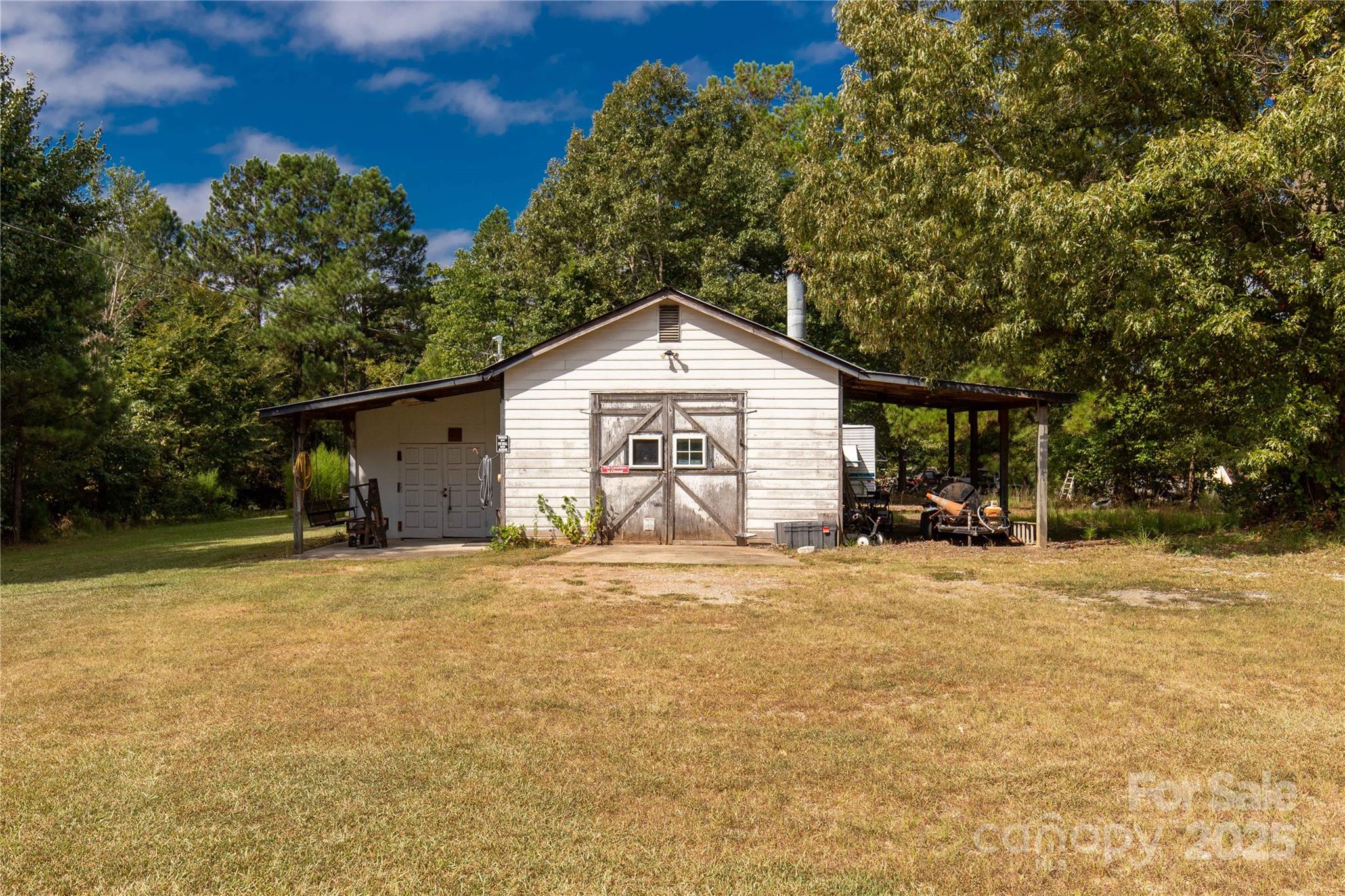 1164 Stroupe Road Lancaster, SC 29720 - Photo 30 of 37 a front view of a house with a yard and garage