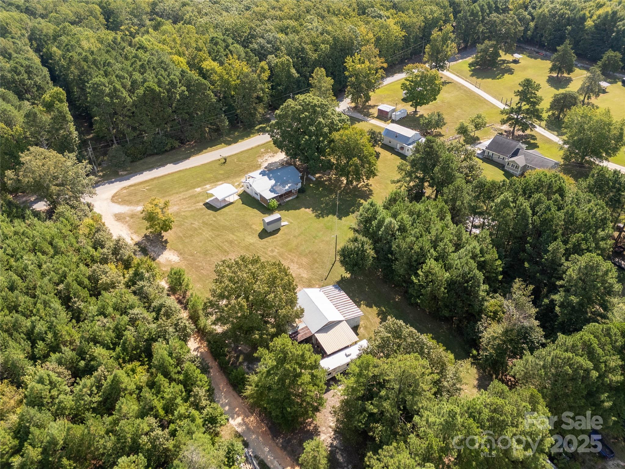 1164 Stroupe Road Lancaster, SC 29720 - Photo 7 of 37 an aerial view of residential house with outdoor space and trees all around