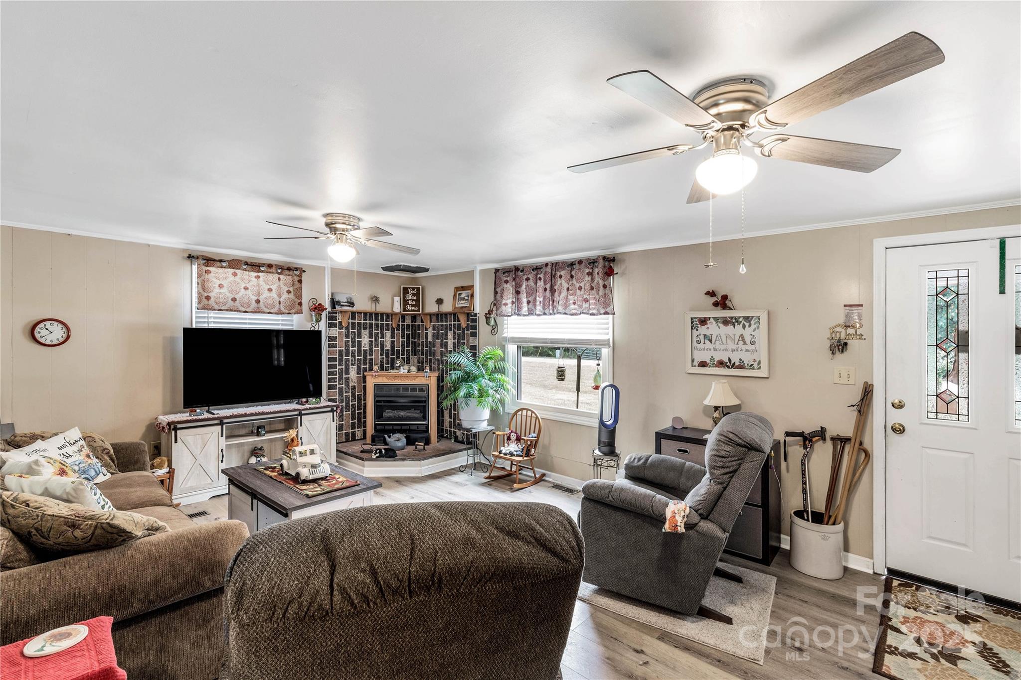 1164 Stroupe Road Lancaster, SC 29720 - Photo 10 of 37 a living room with furniture a large window and a flat screen tv