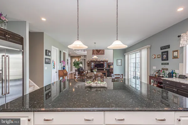 a living room with fireplace furniture and a flat screen tv