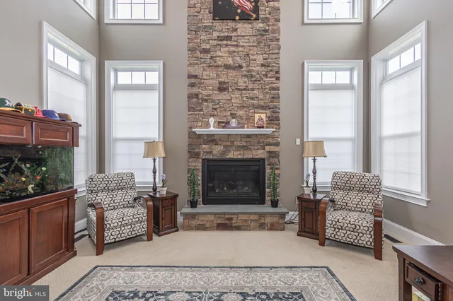 a view of a livingroom with furniture window entryway and stairs