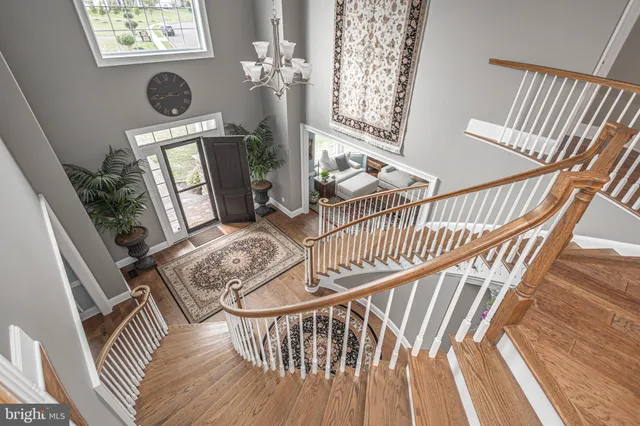 a bedroom with a bed and dresser with mirror