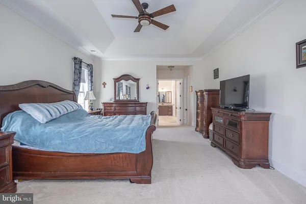 a spacious bathroom with a tub sink and mirror