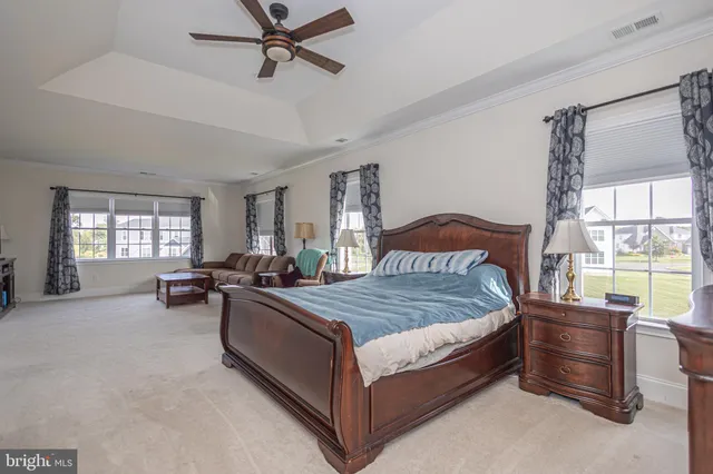 a spacious bathroom with a tub sink and double vanity
