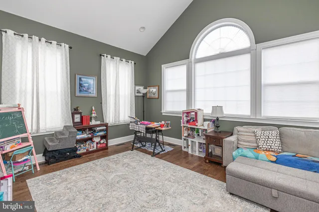 a front view of a house with a yard table and chairs