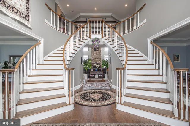 a view of a hallway with wooden floor and windows